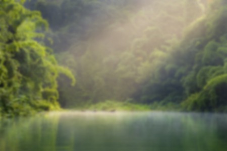 Blur images of lake at morning with mistの写真素材
