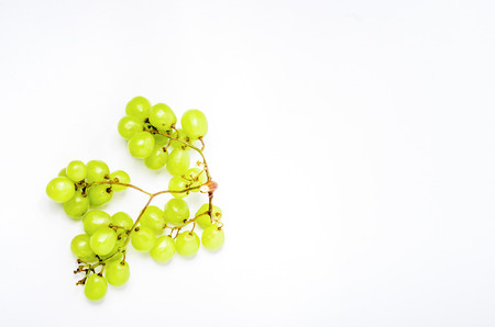 Green Grapes shoot over white backgroundの写真素材