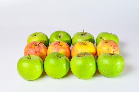 Red And Green Apples shoot over white background. Shallow depth of field. Focus on the closes distance.の写真素材