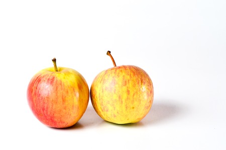Red Apples shoot over white background. Shallow depth of field. Focus on the closes distance.の写真素材