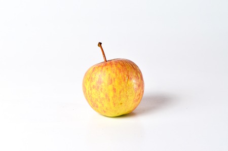 Red Apples shoot over white background. Shallow depth of field. Focus on the closes distance.の写真素材
