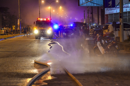 Kedah, Malaysia - March 8, 2015 : A supermarket was burned terribly and almost 10 Fireman vehicle...