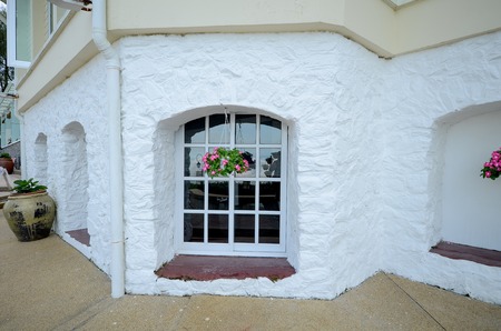 Close view of English building with hanging  flowerの写真素材