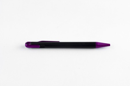 Purple and black pen on white background
