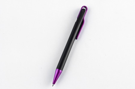 Purple and black pen on white backgroundの写真素材