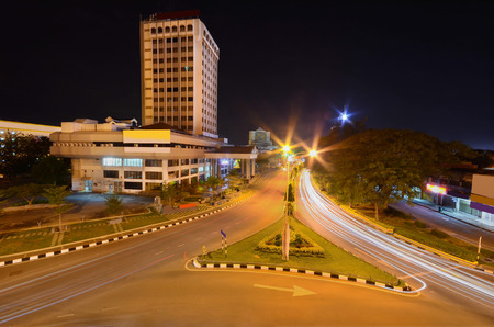 Car light trail in beautiful city at nightの写真素材