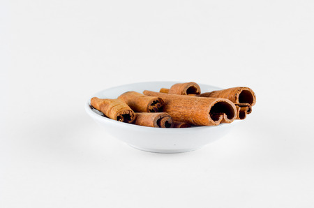 Cinnamon Spice in bowl over white background