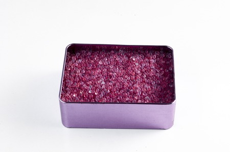 Purple silica gel in rectangle container. The silica is currenly expired and unable to remove moisture anymore.の写真素材