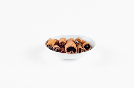 Cinnamon Spice in bowl over white background