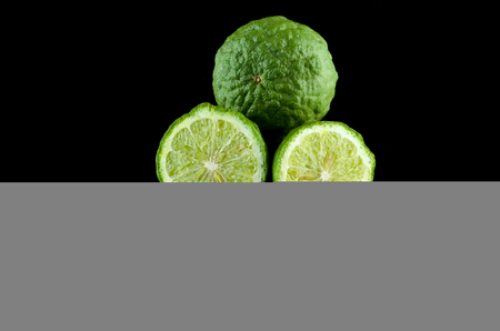 Kaffir Lime or Bergamot over black background