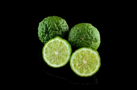 Kaffir Lime or Bergamot over black backgroundの写真素材