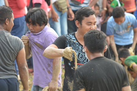 Perlis, Malaysia - March 05, 2017: Perlis East Wind Carnival was a yearly event of Perlis. Consist of food booth, game, challange, contest, and fun park. Capturing Eel Contestのeditorial素材