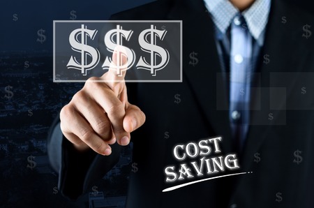 Business man pointing hand on transparent money symbol with text written Cost Savingの写真素材