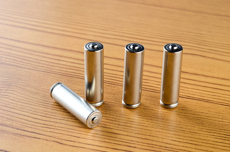 Battery over wooden background