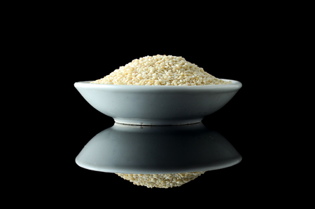 Sesame Seeds over black backgroundの写真素材