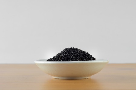 Basil Seeds over wooden backgroundの写真素材
