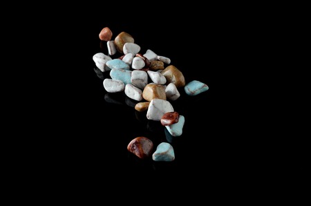 Stone shape candy over black background