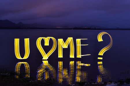 Light painting at night with word You Love Meの写真素材