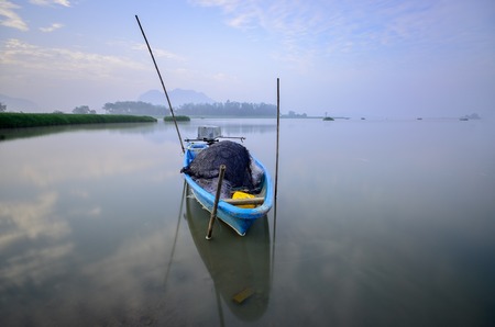 Fisherman Boat used to catch fish in lakeの写真素材