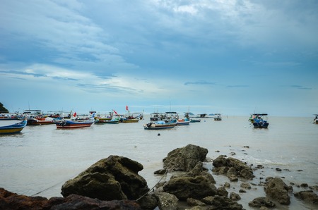 Beautiful shore with fisherman boatsの写真素材