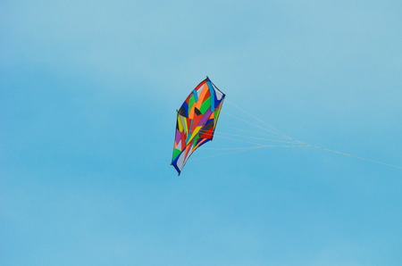 Close view of kite flying in blue skyの写真素材