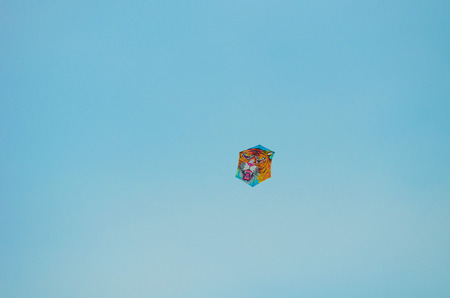 Close view of kite flying in blue skyの写真素材