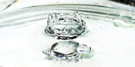 beautiful water drop splash in freezing motion H20 の写真素材