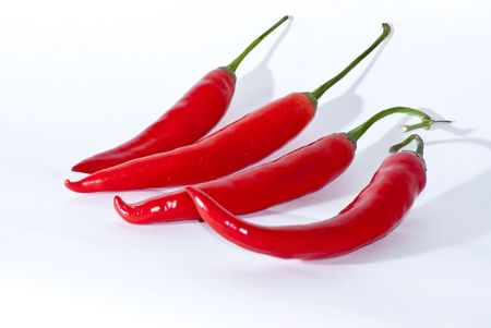 Red hot chilli peppers isolated white backgroundの写真素材