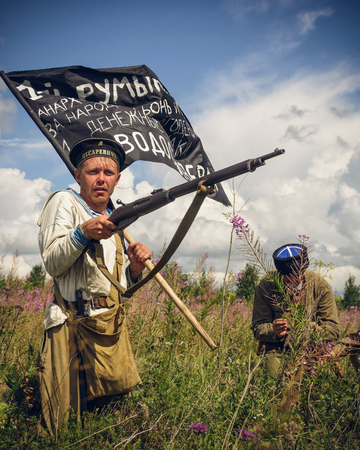 POKROVSKOE, SVERDLOVSK OBLAST, RUSSIA - JULY 17, 2016: Historical reenactment of Russian Civil war in the Urals in 1919. Soldier-anarchistのeditorial素材
