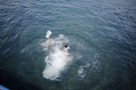 Kids swimming at the Jetty in Banyuwangi Indonesia