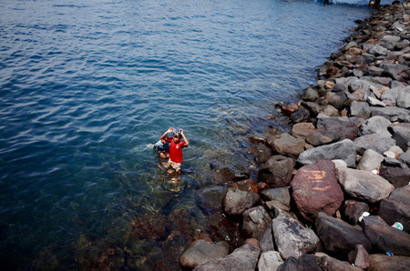 Kids swimming at the Jetty in Banyuwangi Indonesiaのeditorial素材