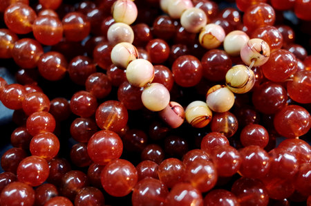 Red beads on a black background close-up. Selective focus.の写真素材