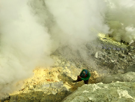 Unidentified man in the crater of Kawah Ijen volcano.の写真素材