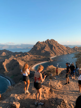 Tourists taking pictures of the sea in Santorini, Greeceの写真素材