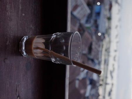 Coffee in a glass cup on a wooden background. Selective focus.
