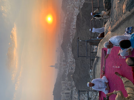 people climbing a cliff in the morning