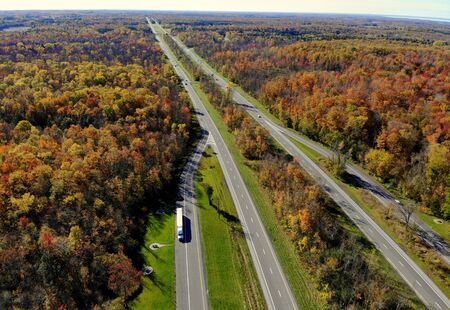 The aerial view of stunning fall foliage and traffic near highway Interstate 81 of Watertown, New York, U.S.Aの写真素材