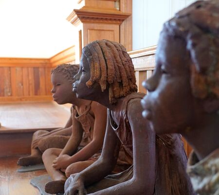 Edgard, Louisiana, U.S.A - February 2, 2020 - The statues of the African American girls inside the church near Whitney Plantationのeditorial素材