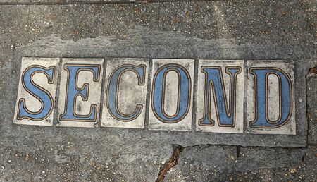 New Orleans, Louisiana, U.S.A - February 4. 2020 - The Second Street sign on the ground by The Garden Districtの写真素材