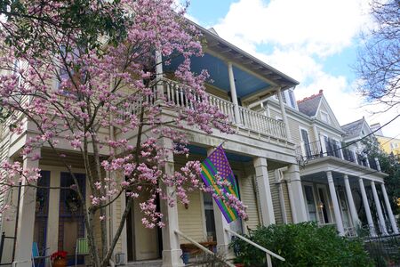 New Orleans, Louisiana, U.S.A - February 4, 2020 - Beautiful mansion with pink magnolia trees by The Garden Districtのeditorial素材