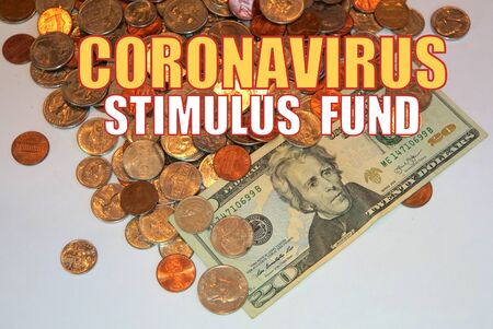 Coronavirus Stimulus Fund on American coins and dollar bill backgroundの写真素材