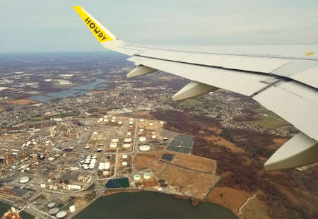Philadelphia, Pennsylvania, U.S.A - March 13, 2020 - The view of the industrial area from the window of a Spirit Airlines planeのeditorial素材
