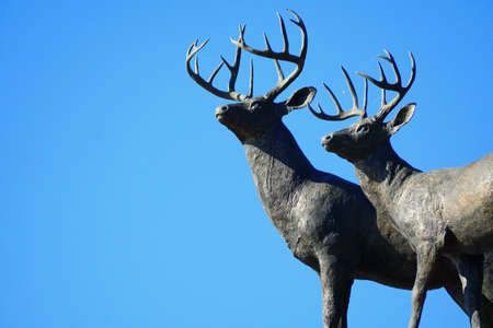 Alexandria Bay, New York, U.S.A - October 24, 2019 - The statues of deer with antlers on top of the arch of Boldt Castleのeditorial素材
