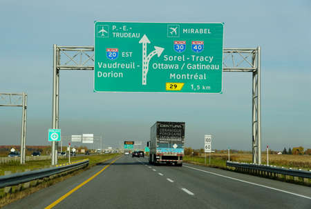 Montreal, Canada - October 28, 2019 - The view of the traffic on the highway towards the airports, and exits into Route 20, Route 30 and Route 40のeditorial素材