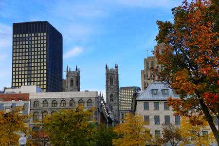 Montreal, Canada - October 28, 2019 - The view of the buildings in the city surrounded by stunning colors of fall foliageのeditorial素材