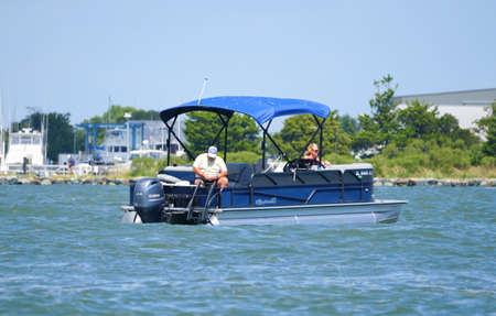 Bethany Beach, Delaware, U.S.A - September 2, 2019 - Anglers on the pontoon boat fishing for flounder near Indian River Inlet in the summerのeditorial素材