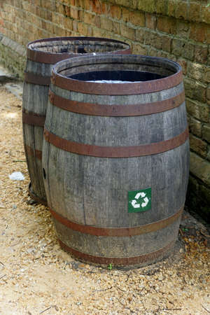 Williamsburg, Virginia, U.S.A - June 30, 2020 - A brown barrel for trash can and recycle bins