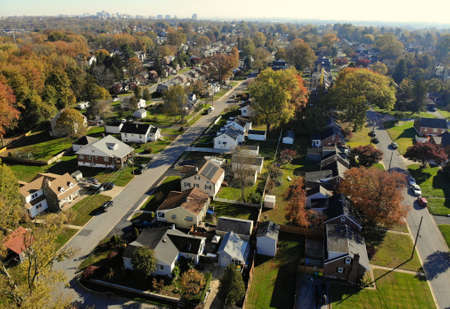 Newport, Delaware, U.S.A - November 11, 2020 - The aerial view of the neighborhood surrounded by stunning colors of fall foliageのeditorial素材