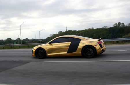 Chicago, Illinois, U.S.A - October 14, 2018 - A shiny gold color Audi Quattro GT sports car on the highwayのeditorial素材