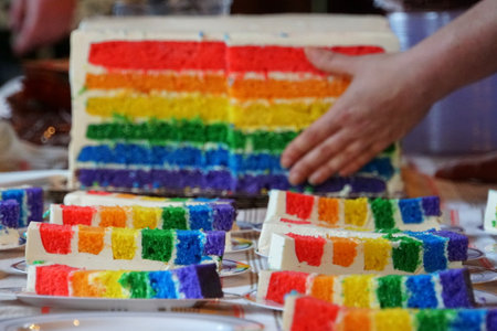 The slices of rainbow cakes on top of the table